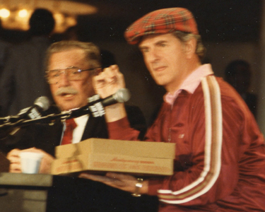 Bill Mayhugh with a box of onion donuts from Montgomery Donuts